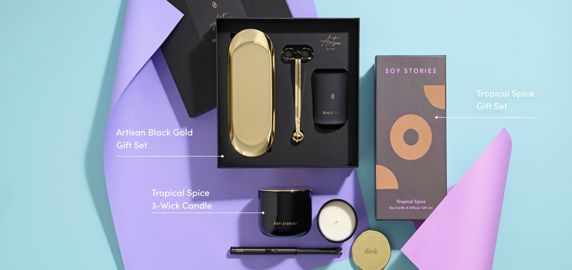 A shot of 3 dusk products, Artisan Black Gold Gift Set, Tropical Spice 3-Wick Candle, and Tropical Spice Gift Set